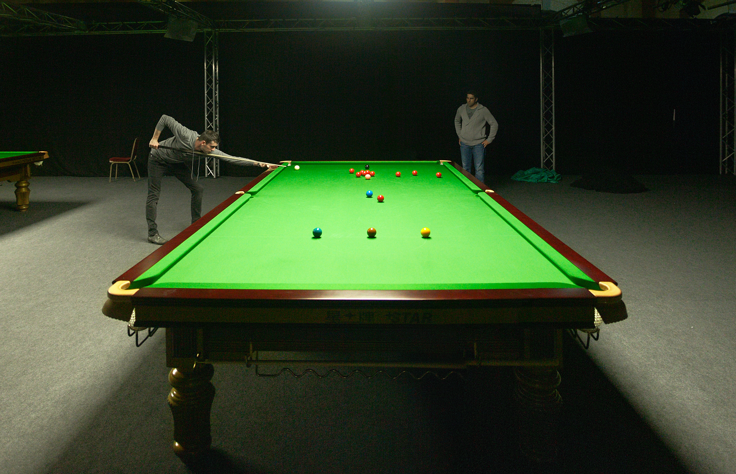 A green ball on a table